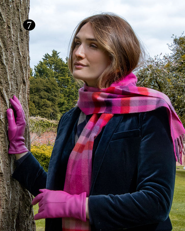 Woman wearing lined leather gloves in hot pink