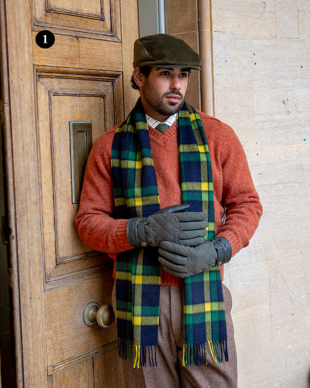 Man wearing touchscreen olive water resistant lined leather gloves with waxed cotton quilting