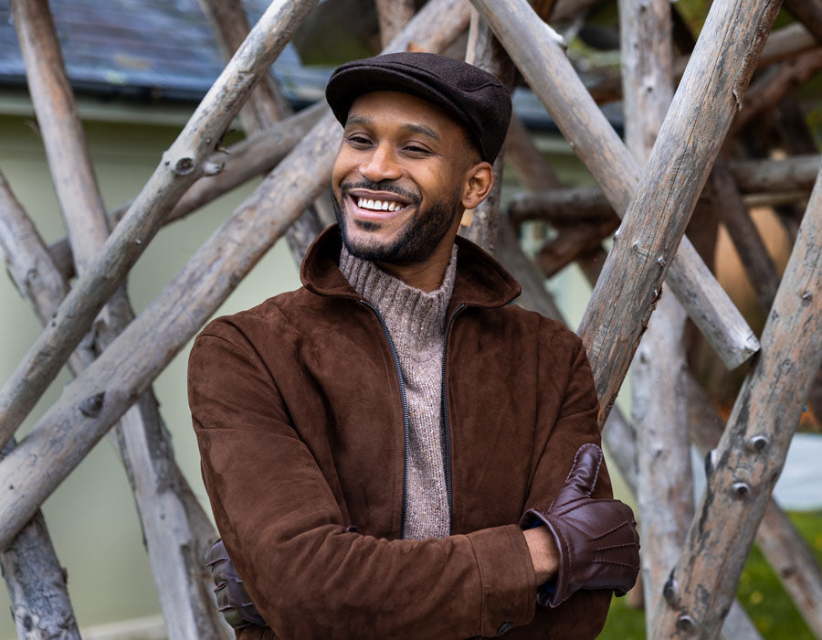 Man wearing flat cap in brown outdoors